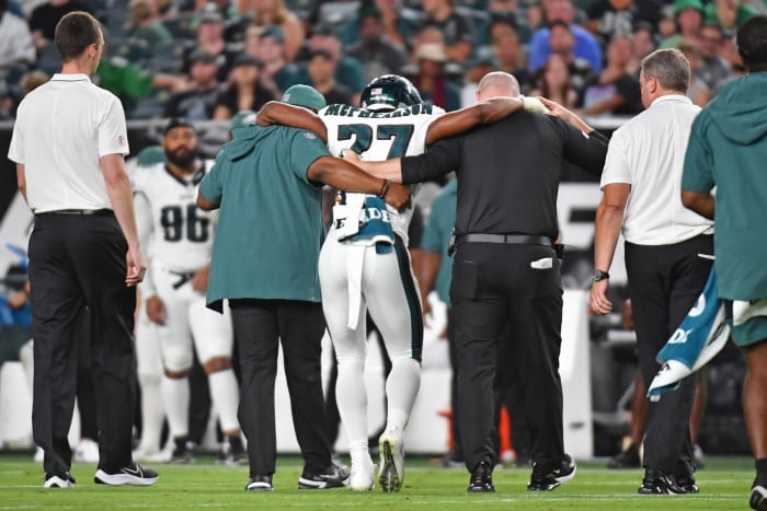 Zech McPhearson is helped off after suffering a torn Achilles.